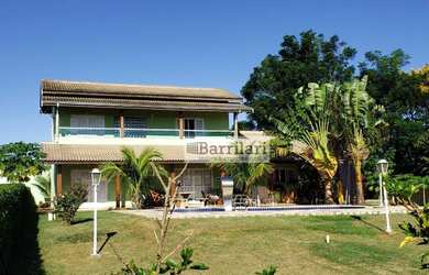 Imagem: A casa possui 4 Dormitórios, 5 Banheiros, 5 Vagas na garagem