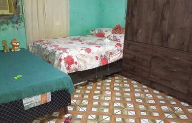 Imagem: A casa possui 2 Dormitórios e 1 Banheiro e está localizado