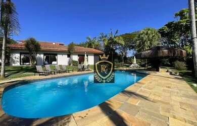 Imagem: A casa em condomínio possui 5 Dormitórios, 5 Banheiros, 5