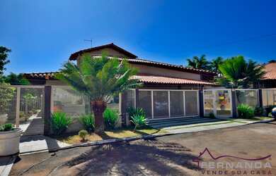 Imagem: A casa possui 4 Dormitórios, 5 Banheiros, 3 Vagas na garagem