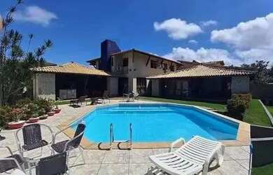 Imagem: A casa possui 5 Dormitórios, 5 Banheiros, 4 Vagas na garagem