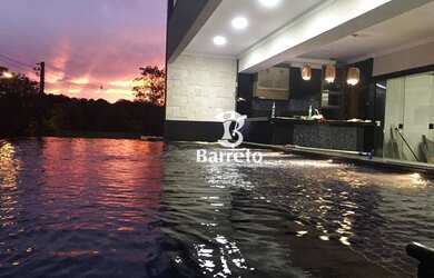 Imagem: A casa em condomínio possui 4 Dormitórios, 5 Banheiros, 5