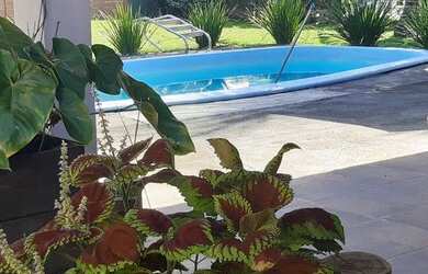 Imagem: A casa possui 5 Dormitórios, 5 Vagas na garagem e está localizado