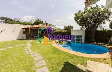 Imagem: A casa possui 4 Dormitórios, 5 Banheiros, 5 Vagas na garagem