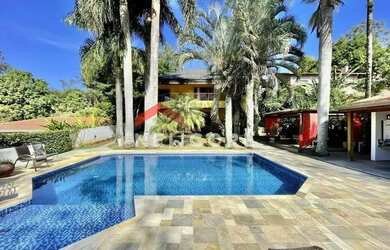 Imagem: A casa em condomínio possui 5 Dormitórios, 5 Banheiros, 4