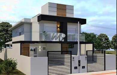 Imagem: A casa possui 3 Dormitórios, 2 Banheiros, 2 Vagas na garagem