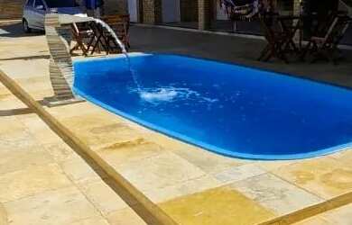 Imagem: A casa possui 4 Dormitórios, 5 Banheiros, 5 Vagas na garagem