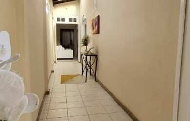 Imagem: A casa possui 3 Dormitórios, 3 Banheiros, 2 Vagas na garagem