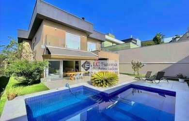 Imagem: A casa em condomínio possui 4 Dormitórios, 5 Banheiros, 5