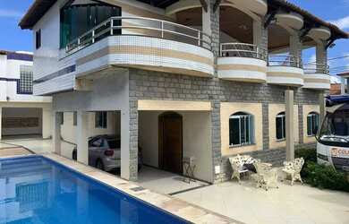 Imagem: A casa possui 4 Dormitórios, 5 Banheiros, 5 Vagas na garagem