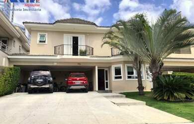 Imagem: A casa possui 4 Dormitórios, 5 Banheiros, 4 Vagas na garagem