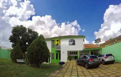 Imagem: A casa possui 4 Dormitórios, 4 Banheiros, 5 Vagas na garagem