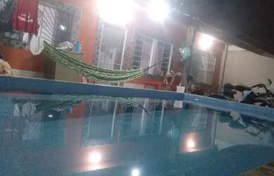 Imagem: A casa possui 2 Dormitórios, Acomodam 11 pessoas, 2 Vagas na