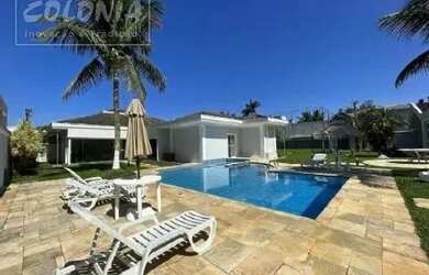 Imagem: A casa possui 5 Dormitórios, 5 Banheiros, 5 Vagas na garagem