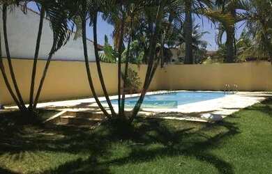 Imagem: A casa possui 4 Dormitórios, 4 Banheiros, 5 Vagas na garagem