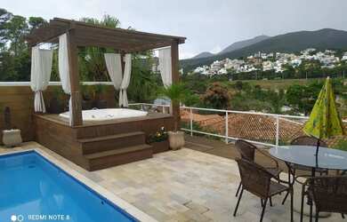 Imagem: A casa possui 5 Dormitórios, 5 Banheiros, 5 Vagas na garagem