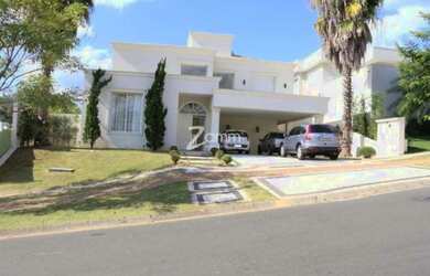 Imagem: A casa possui 4 Dormitórios, 5 Banheiros, 5 Vagas na garagem