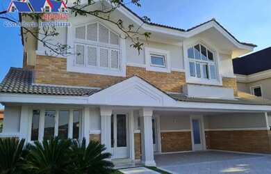 Imagem: A casa possui 4 Dormitórios, 5 Banheiros, 5 Vagas na garagem