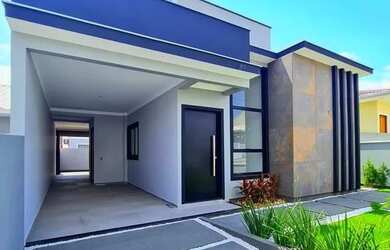 Imagem: A casa possui 3 Dormitórios, 2 Banheiros, 3 Vagas na garagem