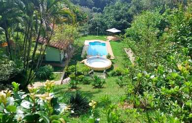 Imagem: A casa em condomínio possui 5 Dormitórios, 5 Banheiros, 4