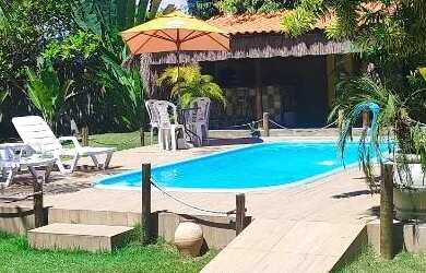 Imagem: A casa possui 3 Dormitórios, 4 Banheiros, 5 Vagas na garagem