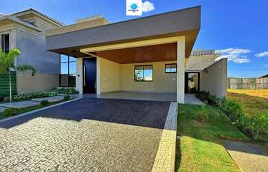 Imagem: A casa possui 4 Dormitórios, 5 Banheiros, 4 Vagas na garagem