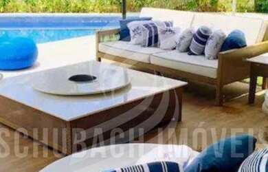 Imagem: A casa em condomínio possui 4 Dormitórios, 5 Banheiros, 2