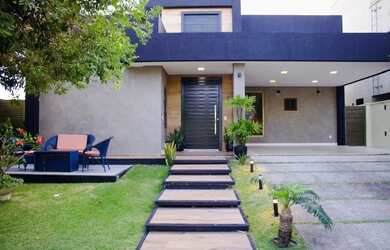 Imagem: A casa possui 4 Dormitórios, 5 Banheiros, 4 Vagas na garagem