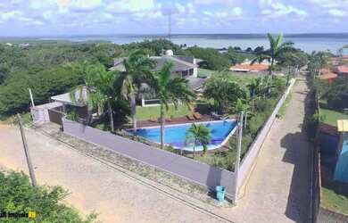 Imagem: A casa possui 5 Dormitórios, 5 Banheiros, 4 Vagas na garagem