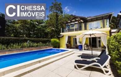 Imagem: A casa possui 3 Dormitórios, 5 Banheiros, 3 Vagas na garagem