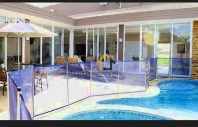 Imagem: A casa possui 4 Dormitórios, 5 Banheiros, 4 Vagas na garagem