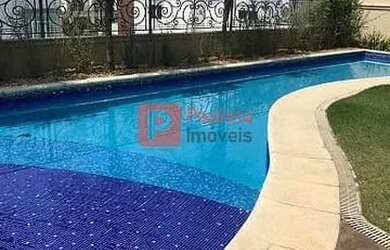 Imagem: A casa possui 4 Dormitórios, 5 Banheiros, 5 Vagas na garagem