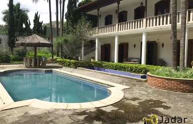 Imagem: A casa possui 3 Dormitórios, 5 Banheiros, 5 Vagas na garagem