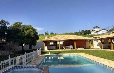 Imagem: A casa possui 5 Dormitórios, 5 Banheiros, 5 Vagas na garagem