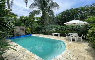 Imagem: A casa possui 5 Dormitórios, 5 Banheiros, 5 Vagas na garagem