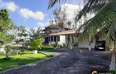 Imagem: A casa possui 5 Dormitórios, 5 Banheiros, 5 Vagas na garagem