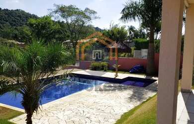 Imagem: A casa em condomínio possui 3 Dormitórios, 4 Banheiros, 5