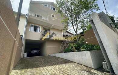 Imagem: A casa possui 3 Dormitórios, 3 Banheiros, 3 Vagas na garagem