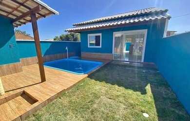 Imagem: A casa possui 2 Dormitórios, 2 Vagas na garagem e está localizado