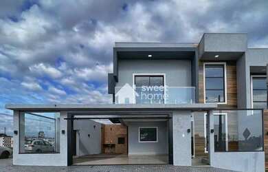 Imagem: A casa possui 3 Dormitórios, 1 Banheiro, 3 Vagas na garagem