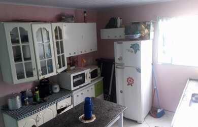 Imagem: A casa possui 2 Dormitórios, 1 Banheiro, 1 Vaga na garagem