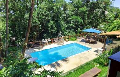 Imagem: A casa em condomínio possui 5 Dormitórios, 5 Banheiros, 3