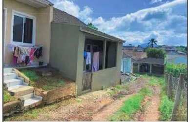 Imagem: A casa possui 3 Dormitórios, 1 Banheiro, 1 Vaga na garagem
