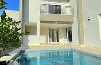 Imagem: A casa em condomínio possui 4 Dormitórios, 4 Banheiros, 5