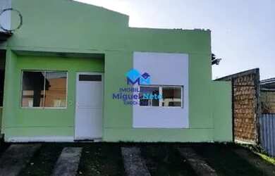 Imagem: A casa possui 3 Dormitórios, 2 Banheiros, 2 Vagas na garagem