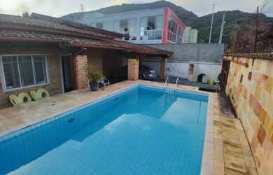 Imagem: A casa possui 3 Dormitórios, 4 Banheiros, 4 Vagas na garagem