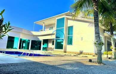 Imagem: A casa possui 4 Dormitórios, 4 Banheiros, 5 Vagas na garagem