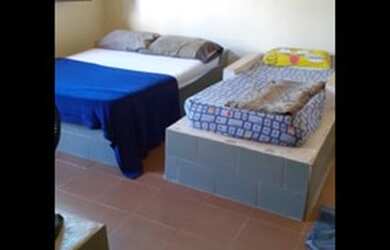 Imagem: A casa possui 3 Dormitórios, 2 Vagas na garagem e está localizado