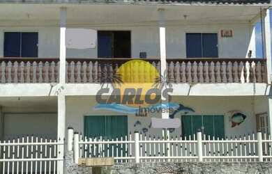 Imagem: A casa possui 3 Dormitórios, 2 Banheiros, 4 Vagas na garagem