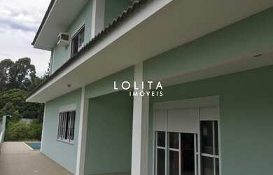 Imagem: A casa possui 5 Dormitórios, 4 Banheiros, 2 Vagas na garagem